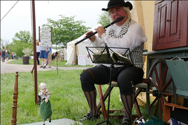 Photo of musician and puppet