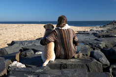 Photo of person on beach with dog