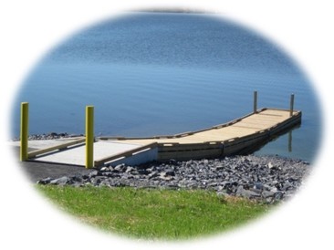 Combined boat ramp with cement trailerable with wooden hand-carry dock alongside.