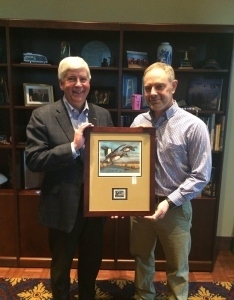 2018 Michigan duck stamp artist Christopher Smith with Gov. Rick Snyder
