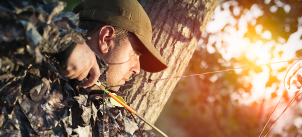 Archery hunter with a bow