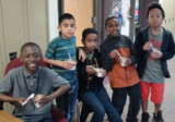 Students eating healthy snacks in school setting