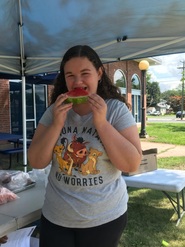 Girl eating watermelon at Windsor Public Schools SFSP site