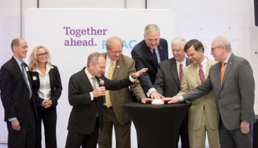 Leaders from RUAG Space and the State of Alabama ceremonially open the Swiss company’s first U.S. manufacturing facility.