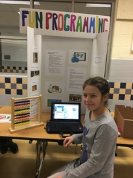 Image of student with coding display