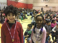 Image of students wearing medal